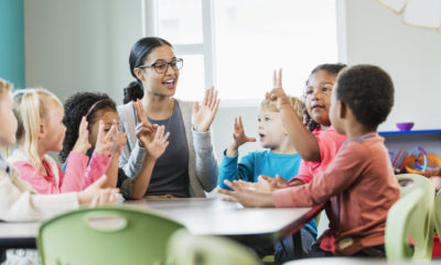 Teacher in the classroom with young students