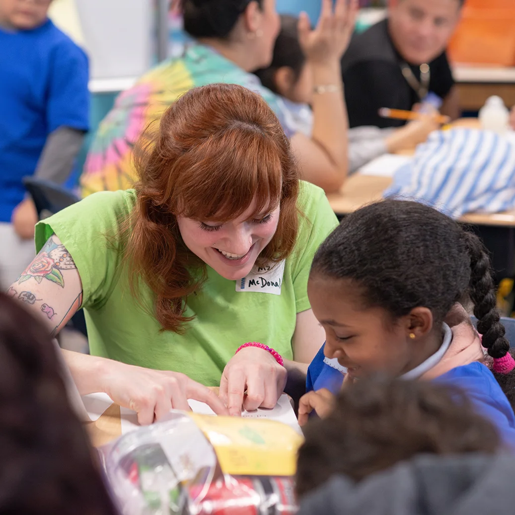 http://A%20teacher%20reads%20with%20a%20student%20in%20a%20classroom